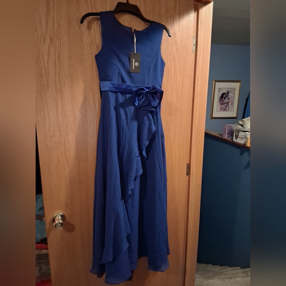 long blue sleeveless gown, satin bow waist, maxi dress. semi sheer ruffled botto